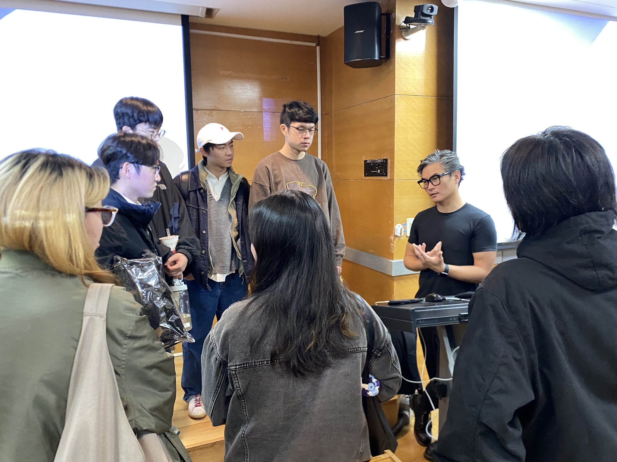 After the lecture, several students approached Jimenez for further guidance.